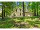A home nestled in the forest with a serene and beautiful landscape at 70 Juliana Dr, Ellenwood, GA 30294