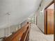 Hallway featuring carpet, wooden handrail, and doors at 70 Juliana Dr, Ellenwood, GA 30294