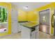 Kitchen featuring island and view to the backyard at 70 Juliana Dr, Ellenwood, GA 30294