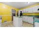 Kitchen featuring green counters and island with cabinets at 70 Juliana Dr, Ellenwood, GA 30294