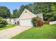Lovely one story home showing two car garage and a well-maintained lawn at 1055 Avalon Dr, Lawrenceville, GA 30044