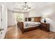 Spacious main bedroom with a tray ceiling and a ceiling fan above a queen-sized bed at 1055 Avalon Dr, Lawrenceville, GA 30044