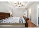 Lovely main bedroom with a tray ceiling and doorway access to the bathroom at 1055 Avalon Dr, Lawrenceville, GA 30044