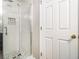The shower has white subway tile, gray tile accents, and a glass door, enhancing its modern design at 1055 Avalon Dr, Lawrenceville, GA 30044