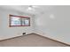 Neutral bedroom with hardwood trim window and carpet at 1189 E Fayetteville Rd, Riverdale, GA 30296