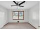 Neutral bedroom with natural light, and a ceiling fan at 1189 E Fayetteville Rd, Riverdale, GA 30296