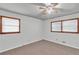 Bright bedroom features dual windows, neutral walls, and flooring at 1189 E Fayetteville Rd, Riverdale, GA 30296