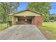 Carport with brick accent and concrete driveway at 1189 E Fayetteville Rd, Riverdale, GA 30296