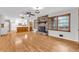 Inviting living room featuring hardwood floors and a stone fireplace at 1189 E Fayetteville Rd, Riverdale, GA 30296