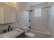 Updated bathroom featuring a modern vanity, and subway-tiled shower-over-tub combo at 1555 New Ne St, Atlanta, GA 30307