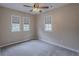Bright bedroom featuring plush carpeting and natural light from multiple windows at 1555 New Ne St, Atlanta, GA 30307