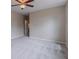 Carpeted bedroom with neutral paint, ceiling fan, and access to an ensuite bathroom at 1555 New Ne St, Atlanta, GA 30307