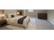 Relaxing bedroom features soft carpeting, a comfortable bed, and ample space for storage and personalization at 1555 New Ne St, Atlanta, GA 30307