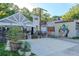 Exterior view of Tesoro restaurant with outdoor seating and mural at 1555 New Ne St, Atlanta, GA 30307