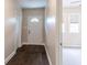 Inviting foyer with beautiful hardwood flooring and a classic front door at 1555 New Ne St, Atlanta, GA 30307