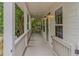 Inviting covered front porch featuring classic columns and a relaxing outdoor space at 1555 New Ne St, Atlanta, GA 30307