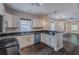 Beautiful kitchen with granite countertops, a stainless dishwasher, and stylish lighting fixtures at 1555 New Ne St, Atlanta, GA 30307