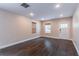Bright living room features hardwood floors, neutral walls, and natural light, with views of the front door at 1555 New Ne St, Atlanta, GA 30307