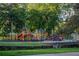 Community playground featuring colorful play structures, slides, and swings for outdoor fun and recreation at 1555 New Ne St, Atlanta, GA 30307
