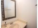 A bathroom features a decorative mirror and vanity with sink at 3053 Shadow Walk Ln, Tucker, GA 30084