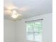 Bright bedroom with a ceiling fan and natural light coming through the window at 3053 Shadow Walk Ln, Tucker, GA 30084