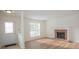 Inviting living room with a brick fireplace, modern flooring, and a well-lit entryway at 3053 Shadow Walk Ln, Tucker, GA 30084