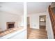 Open-concept living room with a brick fireplace and modern flooring, flowing into the kitchen at 3053 Shadow Walk Ln, Tucker, GA 30084