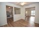 The bright and open living space features light wood floors and an open design to the kitchen at 3053 Shadow Walk Ln, Tucker, GA 30084