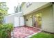 Back patio with brick pavers, white doors, and a sliding glass door leading inside at 3053 Shadow Walk Ln, Tucker, GA 30084