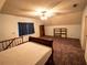 Bedroom with carpet, ceiling fan, furniture, and a bed that has a white sheet on it at 10815 Tuxford Dr, Alpharetta, GA 30022