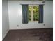 Neutral bedroom with carpet, a ceiling fan, and a window with a view at 10815 Tuxford Dr, Alpharetta, GA 30022