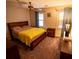Comfortable bedroom with a full-sized bed, carpet, ceiling fan, and a window at 10815 Tuxford Dr, Alpharetta, GA 30022