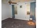 Simple bedroom with carpet flooring, ceiling fan, and natural light from the windows at 10815 Tuxford Dr, Alpharetta, GA 30022