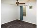 Clean bedroom with carpet, a ceiling fan, and bright natural light at 10815 Tuxford Dr, Alpharetta, GA 30022