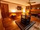 Cozy breakfast nook with hardwood floors, fireplace, and built-in bookshelves perfect for morning coffee at 10815 Tuxford Dr, Alpharetta, GA 30022