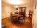 Elegant dining room features classic wainscoting, hardwood floors, and a stylish chandelier at 10815 Tuxford Dr, Alpharetta, GA 30022