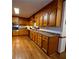 Traditional kitchen with stainless steel appliances and oak hardwood flooring at 10815 Tuxford Dr, Alpharetta, GA 30022
