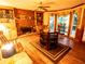 Cozy living room features a fireplace, hardwood floors, and built-in bookshelves at 10815 Tuxford Dr, Alpharetta, GA 30022