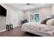 Cozy bedroom featuring a comfy bed, a chair, and a window overlooking the trees at 3045 Moss Stone Lane Sw Ln, Marietta, GA 30064