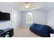Cozy bedroom showcasing a window with shutters, soft carpet, and a comfortable blue beanbag at 3045 Moss Stone Lane Sw Ln, Marietta, GA 30064