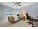Bedroom with a bed, desk, and office chair, offering a functional workspace at 3045 Moss Stone Lane Sw Ln, Marietta, GA 30064