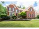 Beautiful brick home with manicured lawn and mature landscaping at 3045 Moss Stone Lane Sw Ln, Marietta, GA 30064