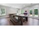 Bright game room with pool table, connect four and an exit to the backyard at 3045 Moss Stone Lane Sw Ln, Marietta, GA 30064