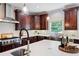 Kitchen with stainless steel sink and appliances, white countertops and wood cabinets at 3045 Moss Stone Lane Sw Ln, Marietta, GA 30064