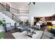Spacious living area with a staircase and open floor plan connecting to a kitchen space at 3045 Moss Stone Lane Sw Ln, Marietta, GA 30064