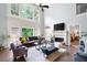 Bright living room with soaring windows, fireplace, and comfortable seating perfect for relaxation at 3045 Moss Stone Lane Sw Ln, Marietta, GA 30064
