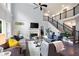 Bright and airy living room features soaring windows and a cozy fireplace for Gathering gatherings at 3045 Moss Stone Lane Sw Ln, Marietta, GA 30064