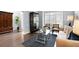 Elegant living room featuring hardwood floors, stylish furniture, and natural light through shuttered windows at 3045 Moss Stone Lane Sw Ln, Marietta, GA 30064