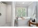 Bathroom features a free-standing tub and glass shower, enhancing its luxurious feel at 3045 Moss Stone Lane Sw Ln, Marietta, GA 30064