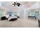 Spacious main bedroom with a trey ceiling, large windows, and sitting area at 3045 Moss Stone Lane Sw Ln, Marietta, GA 30064